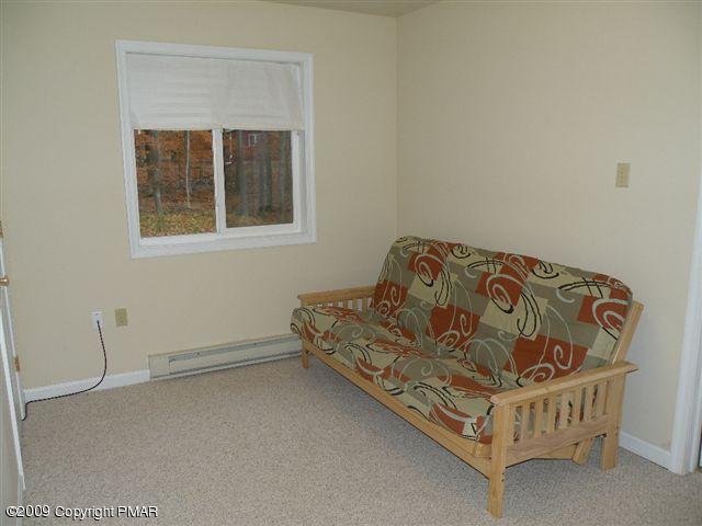 164 Elk Run Road Pocono Lake, PA 18347 - Photo 7 of 11 a bedroom with a bed and window