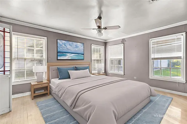 a bedroom with a large bed and a window