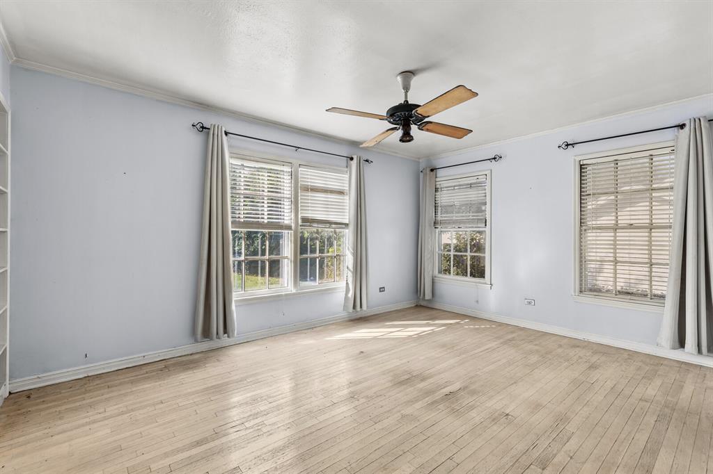 3120 Lyle Avenue Waco, TX 76708 - Photo 15 of 23 a view of an empty room with a window and wooden floor