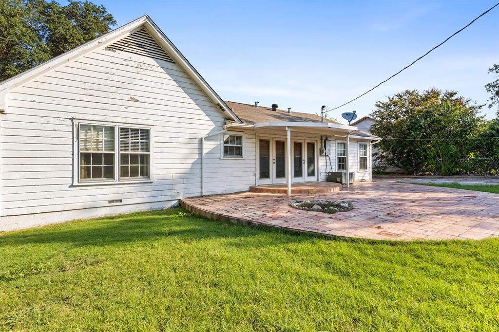 3120 Lyle Avenue Waco, TX 76708 - Photo 22 of 23 a view of a house with a backyard