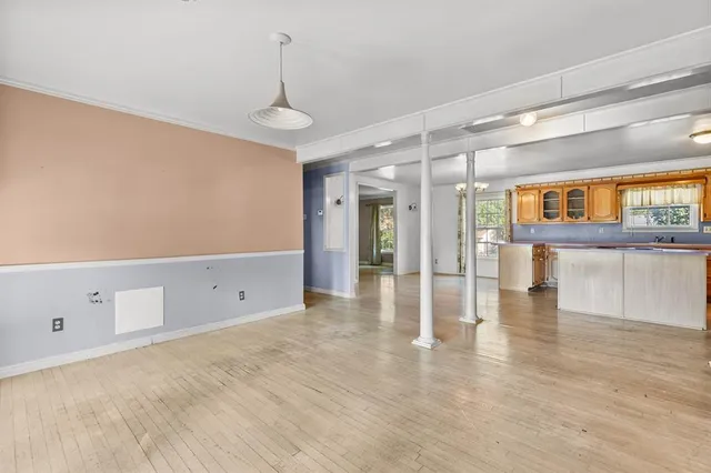a view of a livingroom with wooden floor