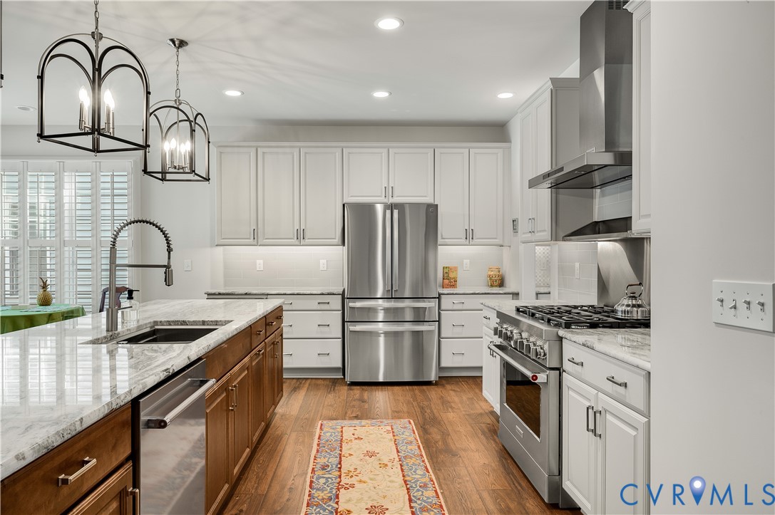 9419 Widthby Road Chesterfield, VA 23832 - Photo 10 of 23 a kitchen with kitchen island stainless steel appliances and sink