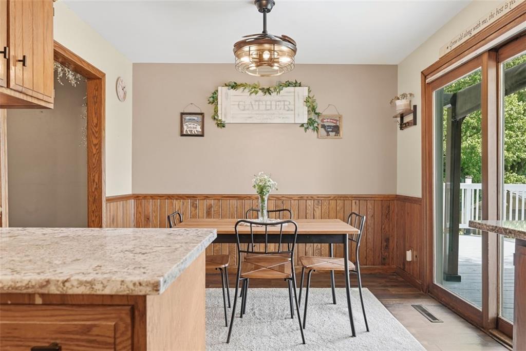 108 Connoquenessing School Road Connoquenessing, PA 16027 - Photo 11 of 50 a view of a dining room with furniture wooden floor and a chandelier