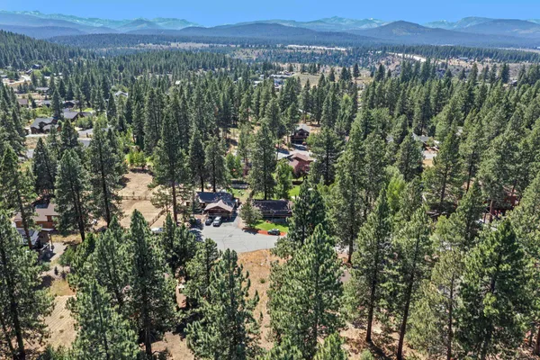 an aerial view of a houses with a yard