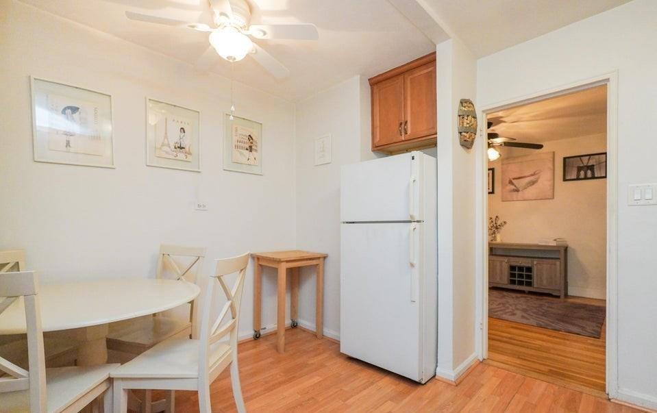 61 Oliver Street, Unit 2V Brooklyn, NY 11209 - Photo 11 of 23 a view of kitchen with furniture and wooden floor