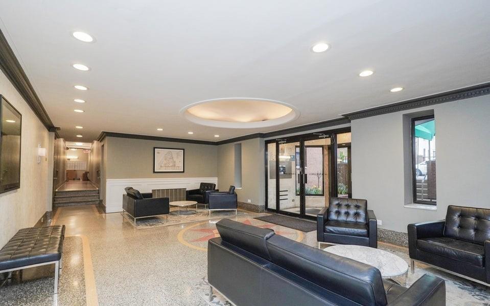 61 Oliver Street, Unit 2V Brooklyn, NY 11209 - Photo 20 of 23 a living room with furniture and a large window