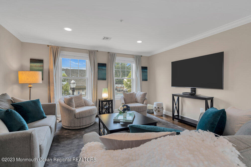 308 Morris Avenue, Unit A Spring Lake, NJ 07762 - Photo 16 of 37 a living room with furniture and a flat screen tv