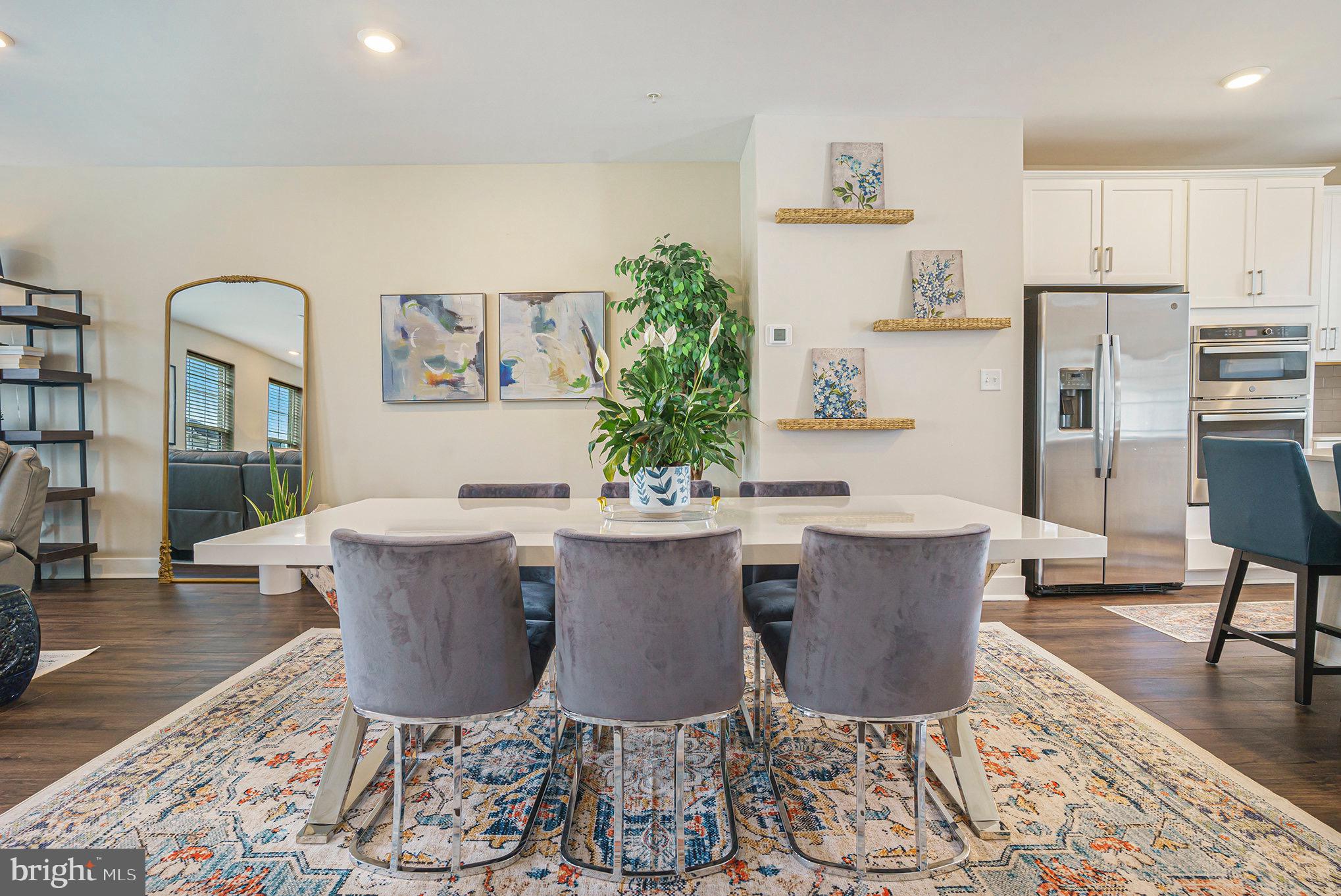 218 Red Leaf Lane Exton, PA 19341 - Photo 9 of 29 a view of a dining room with furniture a rug and wooden floor