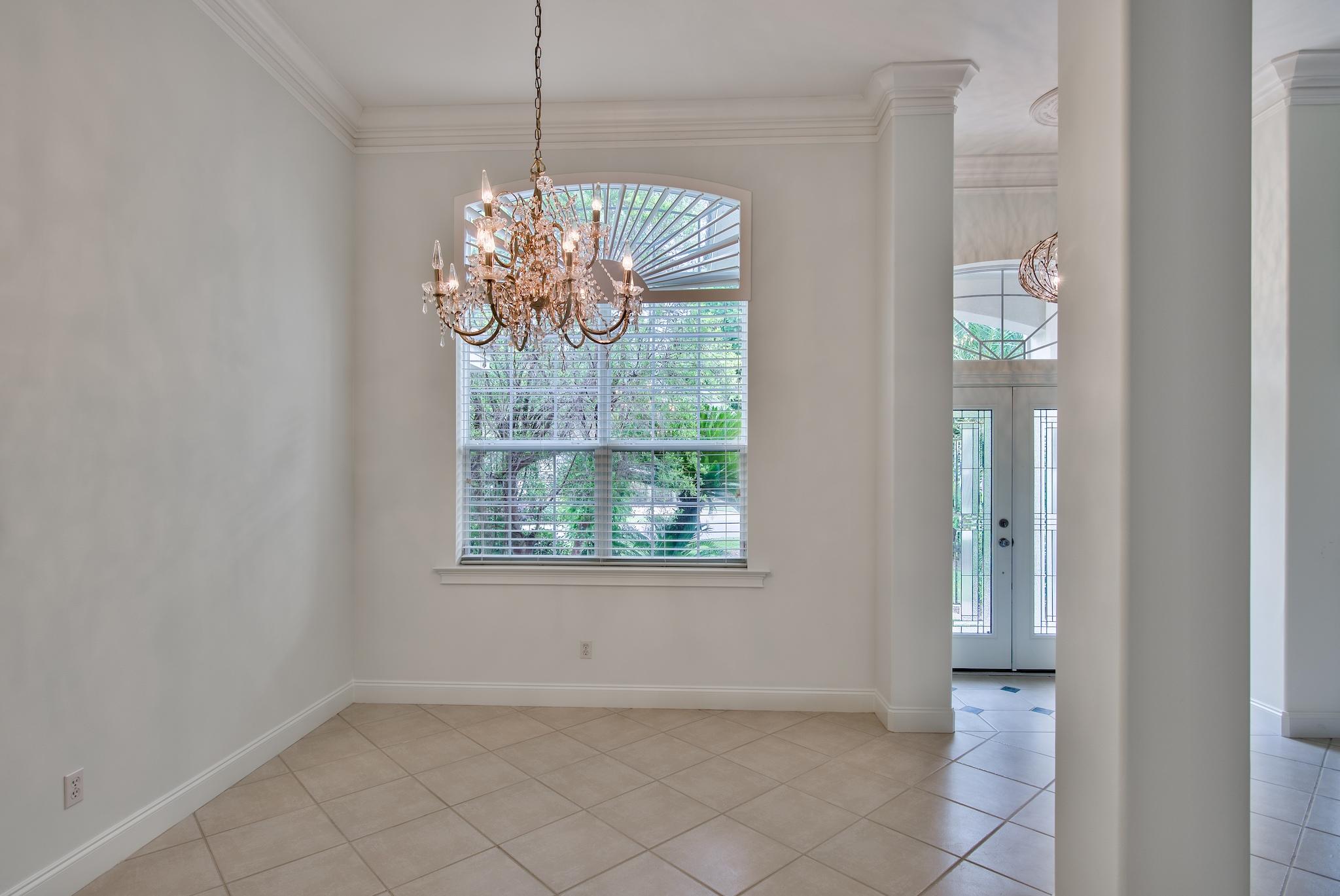 359 Indigo Loop Miramar Beach, FL 32550 - Photo 13 of 47 an empty room with chandelier fan and windows