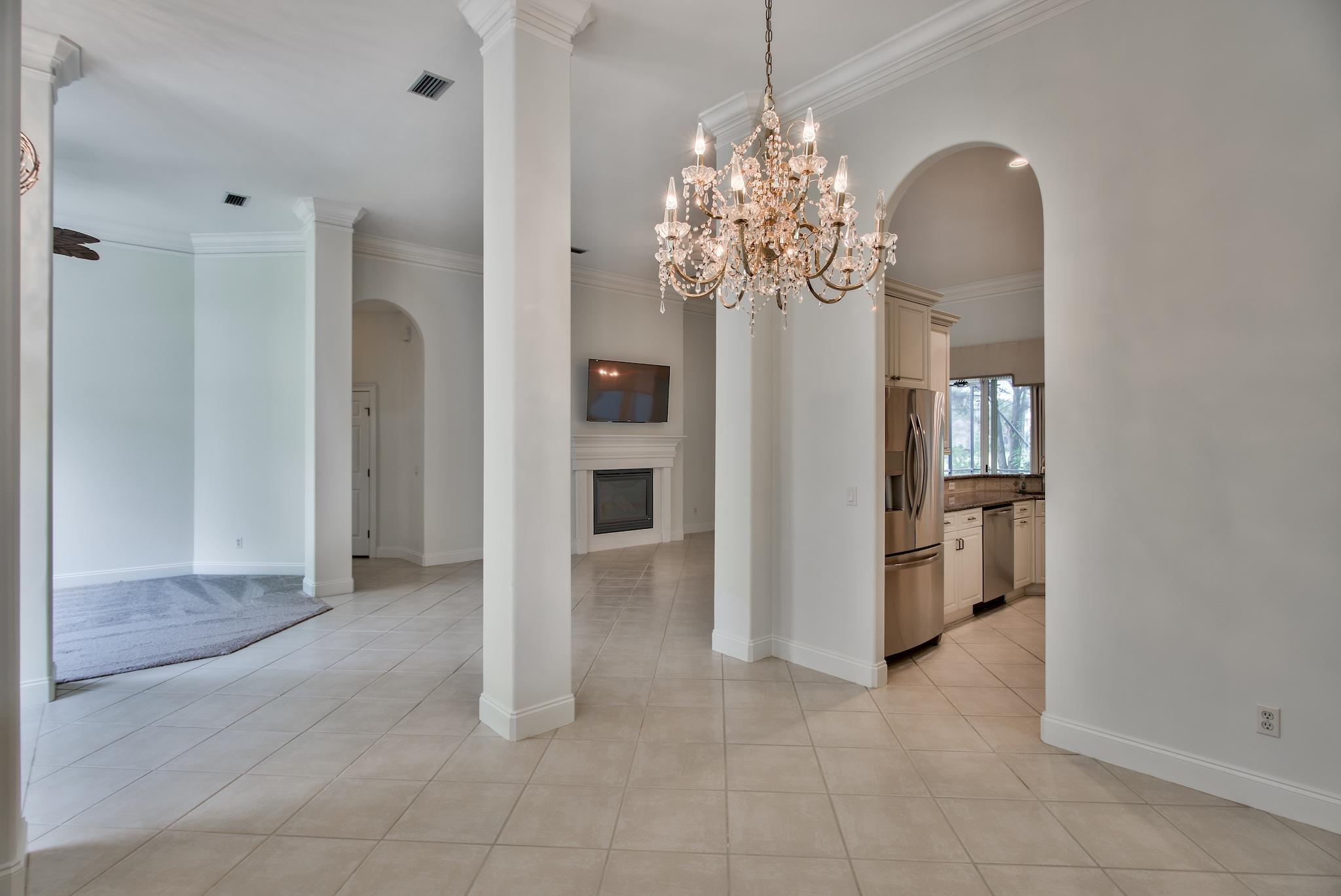 359 Indigo Loop Miramar Beach, FL 32550 - Photo 15 of 47 a view of a room with chandelier and stainless steel appliances