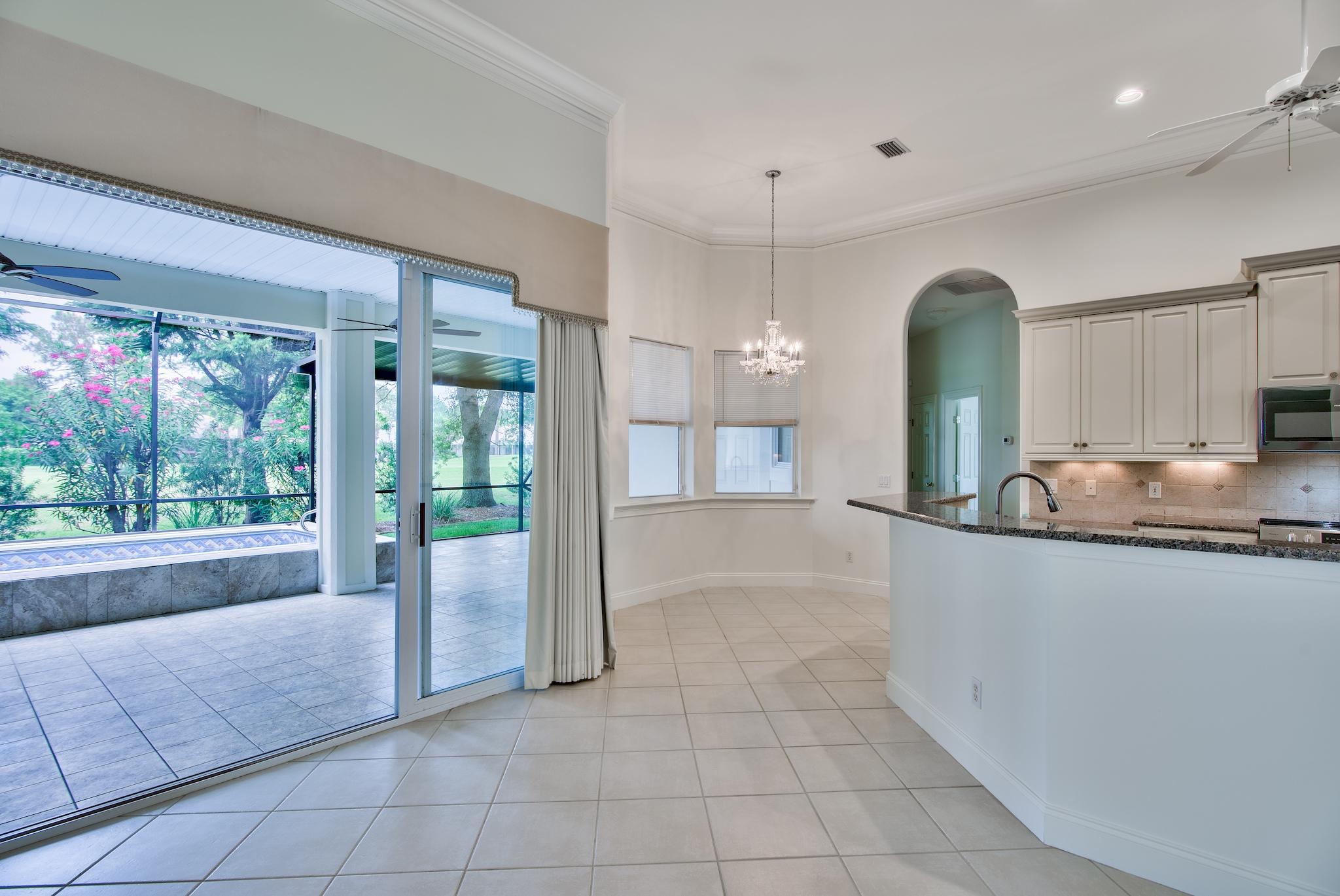 359 Indigo Loop Miramar Beach, FL 32550 - Photo 2 of 47 a large kitchen with granite countertop a large window and a counter space
