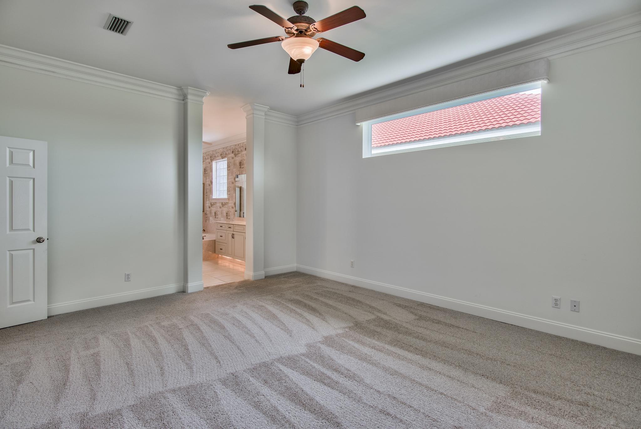 359 Indigo Loop Miramar Beach, FL 32550 - Photo 21 of 47 a view of an empty room with window and a ceiling fan