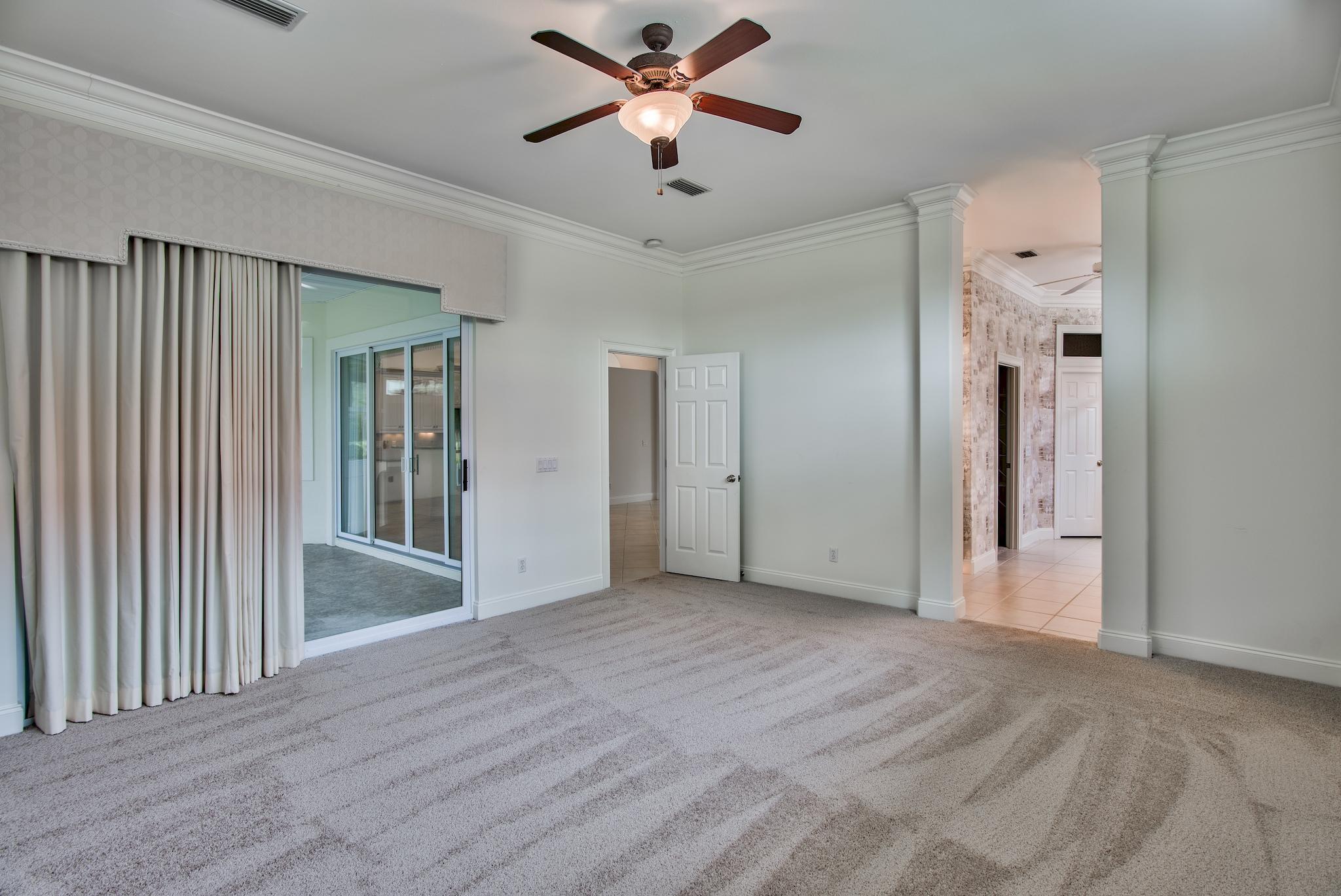 359 Indigo Loop Miramar Beach, FL 32550 - Photo 22 of 47 a view of n empty room with closet and a ceiling fan