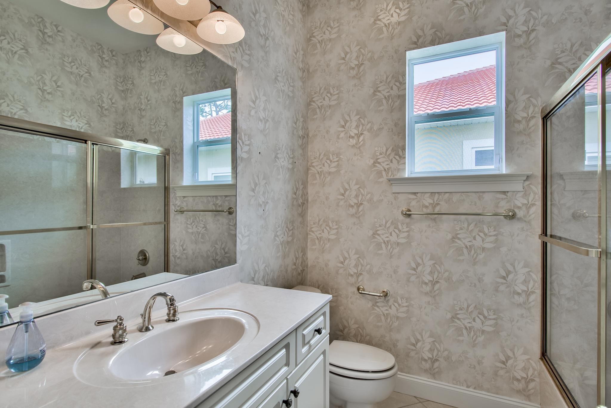 359 Indigo Loop Miramar Beach, FL 32550 - Photo 27 of 47 a bathroom with a sink toilet a mirror and shower
