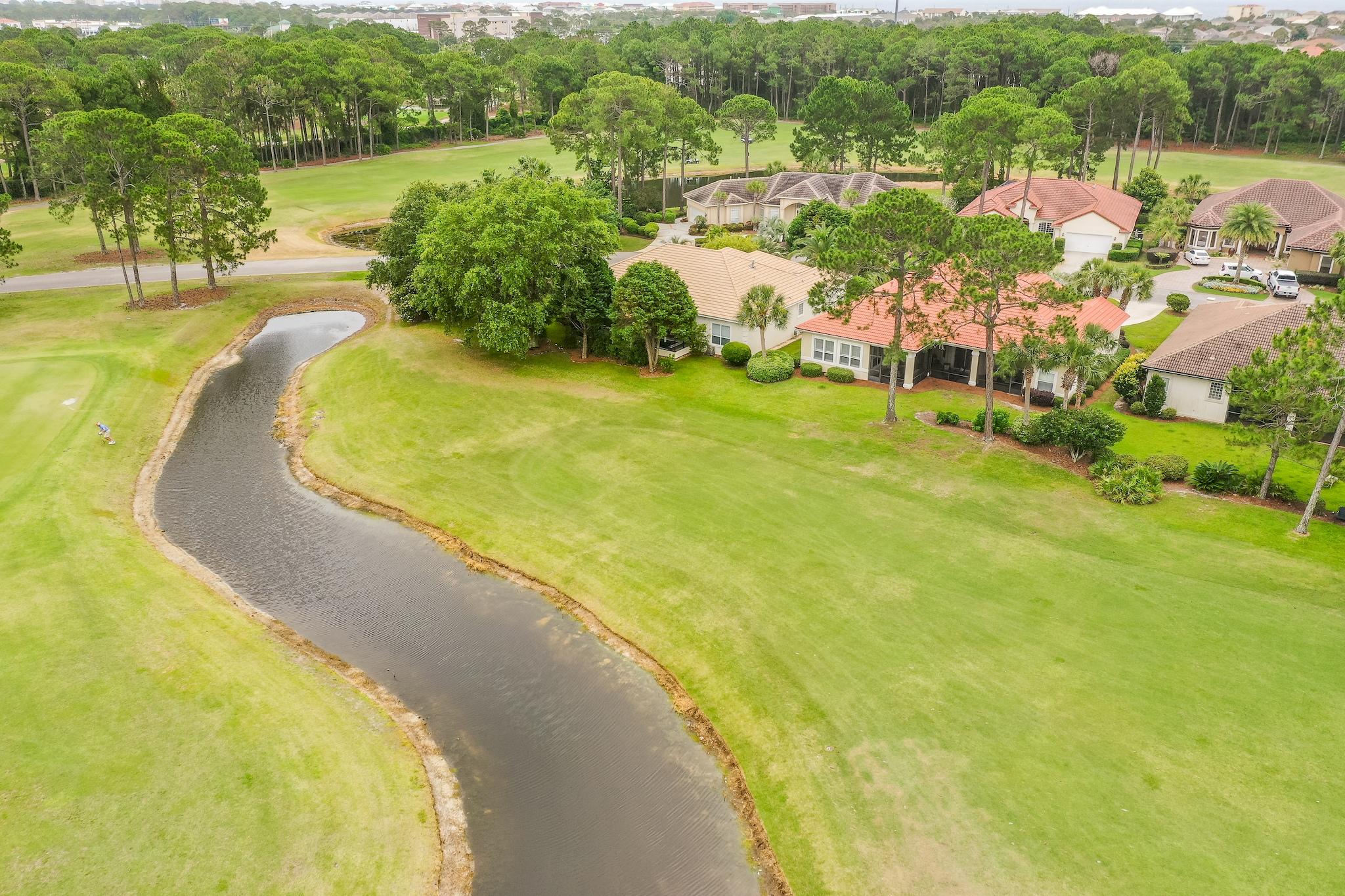 359 Indigo Loop Miramar Beach, FL 32550 - Photo 36 of 47 a view of a lake with a yard and mountain view