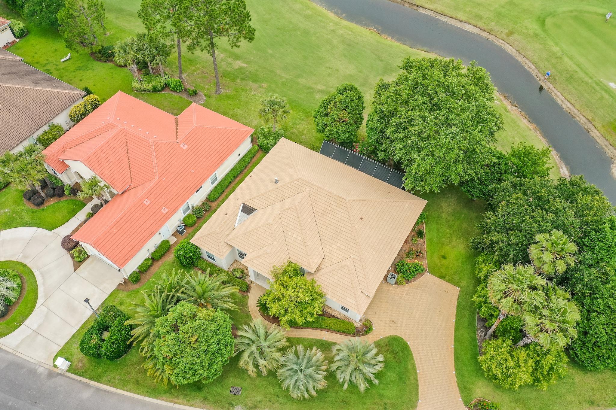 359 Indigo Loop Miramar Beach, FL 32550 - Photo 4 of 47 an aerial view of a house with garden space and a lake view
