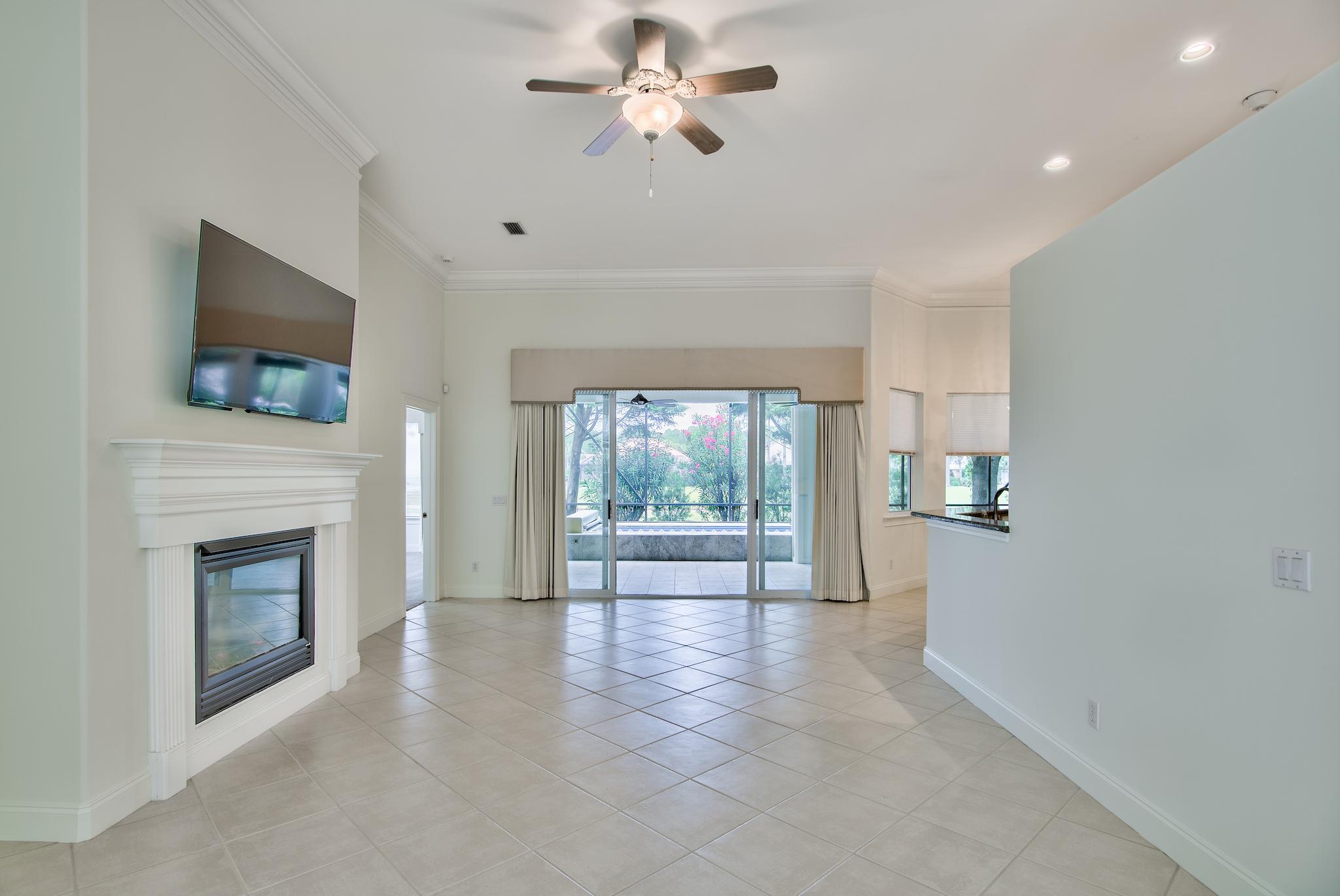 359 Indigo Loop Miramar Beach, FL 32550 - Photo 5 of 47 a view of empty room with fireplace fan and windows
