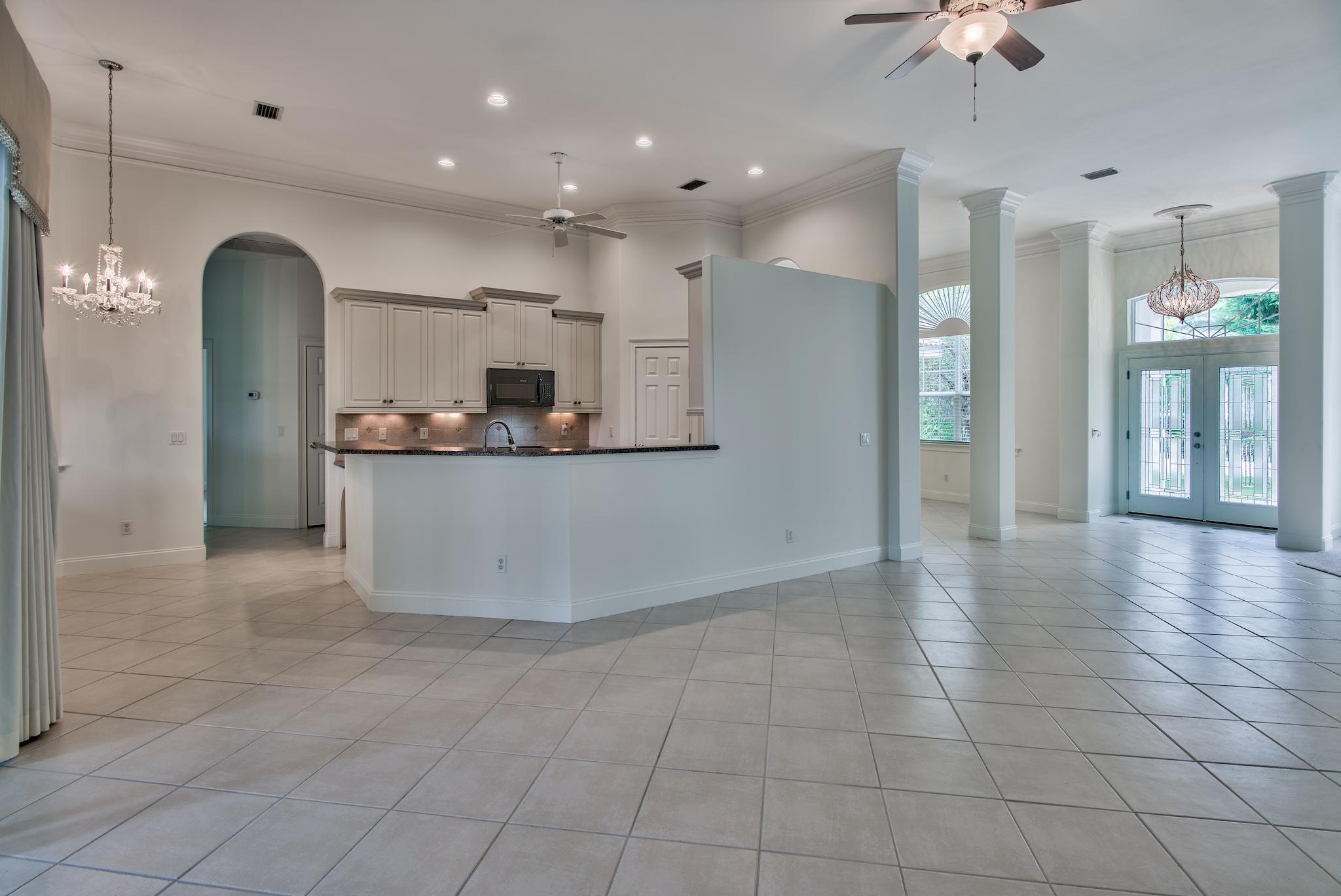 359 Indigo Loop Miramar Beach, FL 32550 - Photo 9 of 47 a view of a kitchen with kitchen island stainless steel appliances refrigerator sink and cabinets