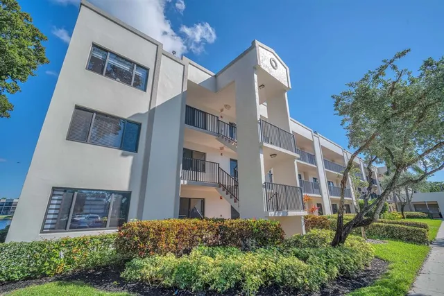 a view of a building with a garden