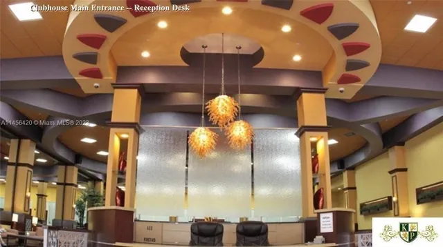 a living room with lots of furniture and a wooden floor