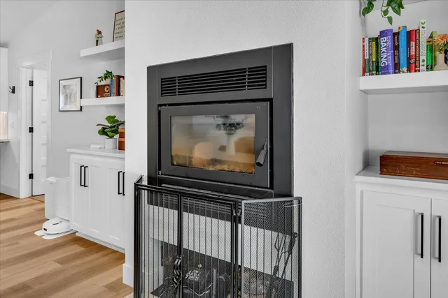 a kitchen with a refrigerator a sink and cabinets