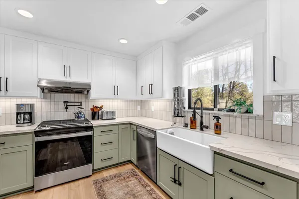 a bathroom with a double vanity sink and a mirror