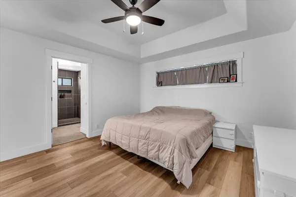 a bedroom with a bed and a bookshelf