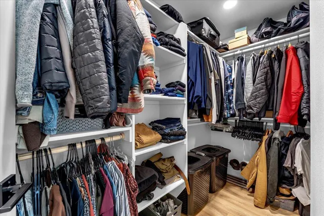 a view of a patio with table and chairs and floor to ceiling window