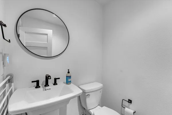 a view of a patio with a dining table and chairs with wooden floor