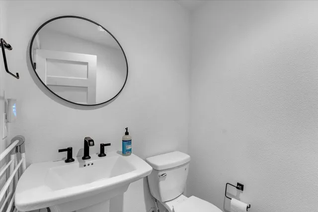a view of a patio with a dining table and chairs with wooden floor