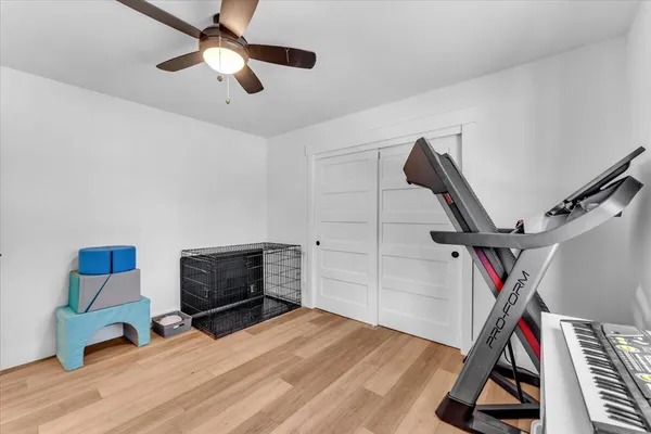 an aerial view of a house with a yard basket ball court and outdoor seating