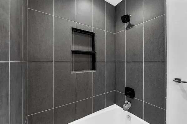 a backyard of a house with barbeque oven fire pit table and chairs