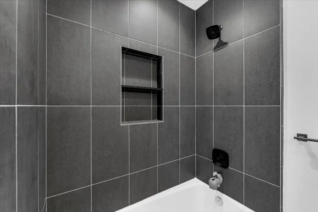 a backyard of a house with barbeque oven fire pit table and chairs