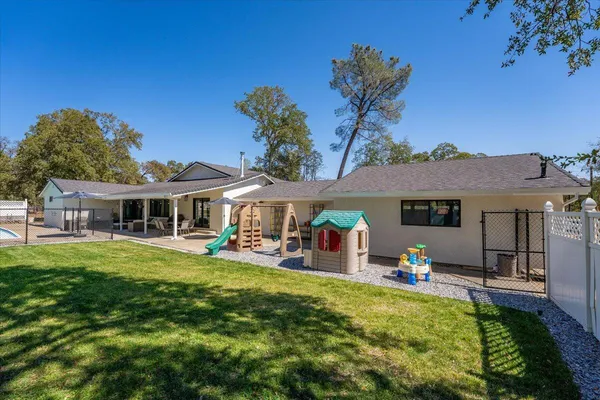 a view of swimming pool with a yard