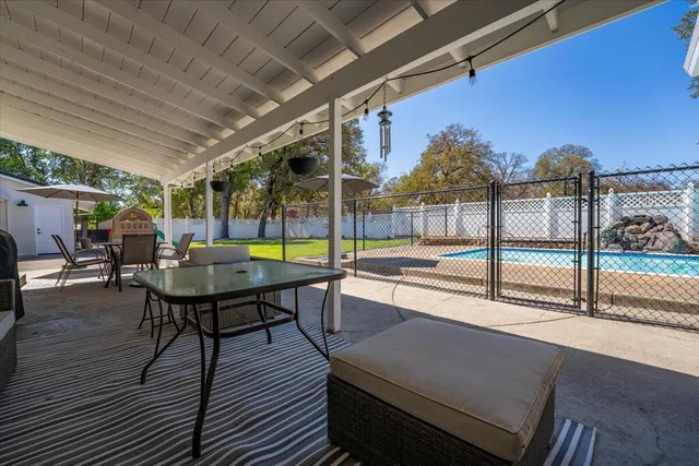 a view of a house with a yard and garage