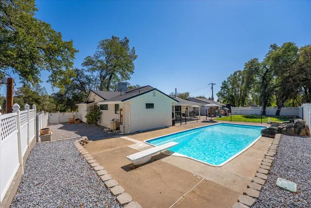 a view of house with a yard