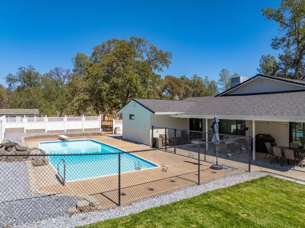 an aerial view of house with yard