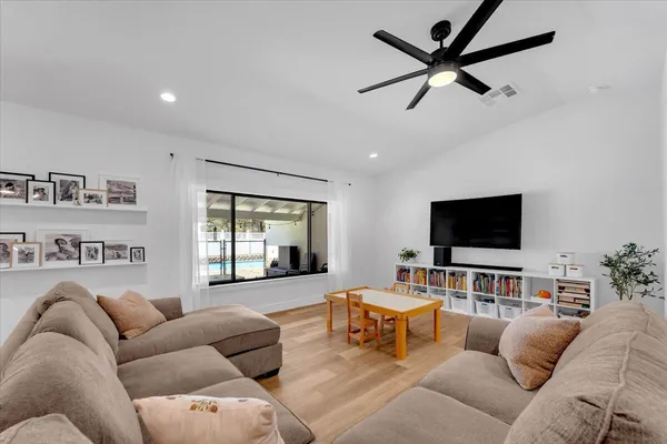 a view of living room with furniture and flat screen tv