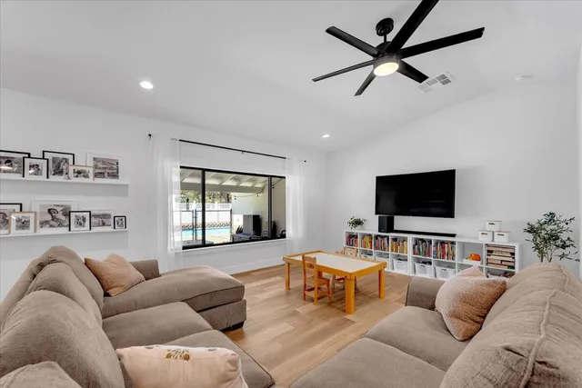 a view of living room with furniture and flat screen tv