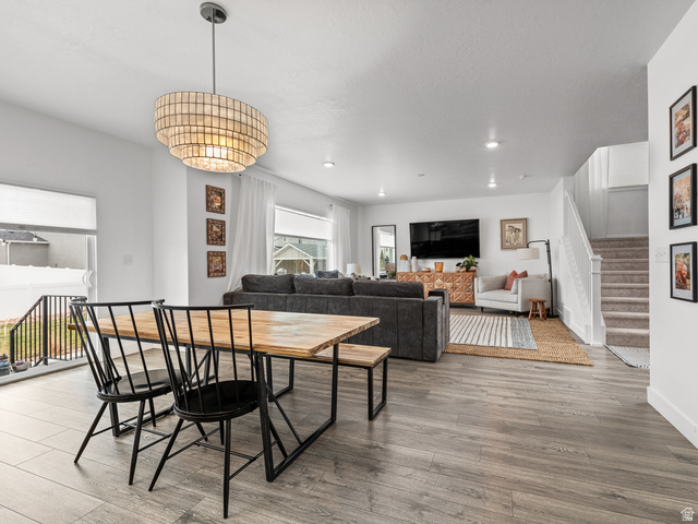 627 South Meade Street Mapleton, UT 84664 - Photo 23 of 48 Open-concept living space featuring wood-finish flooring, recessed lighting, a modern layered chandelier, and white wall finishes