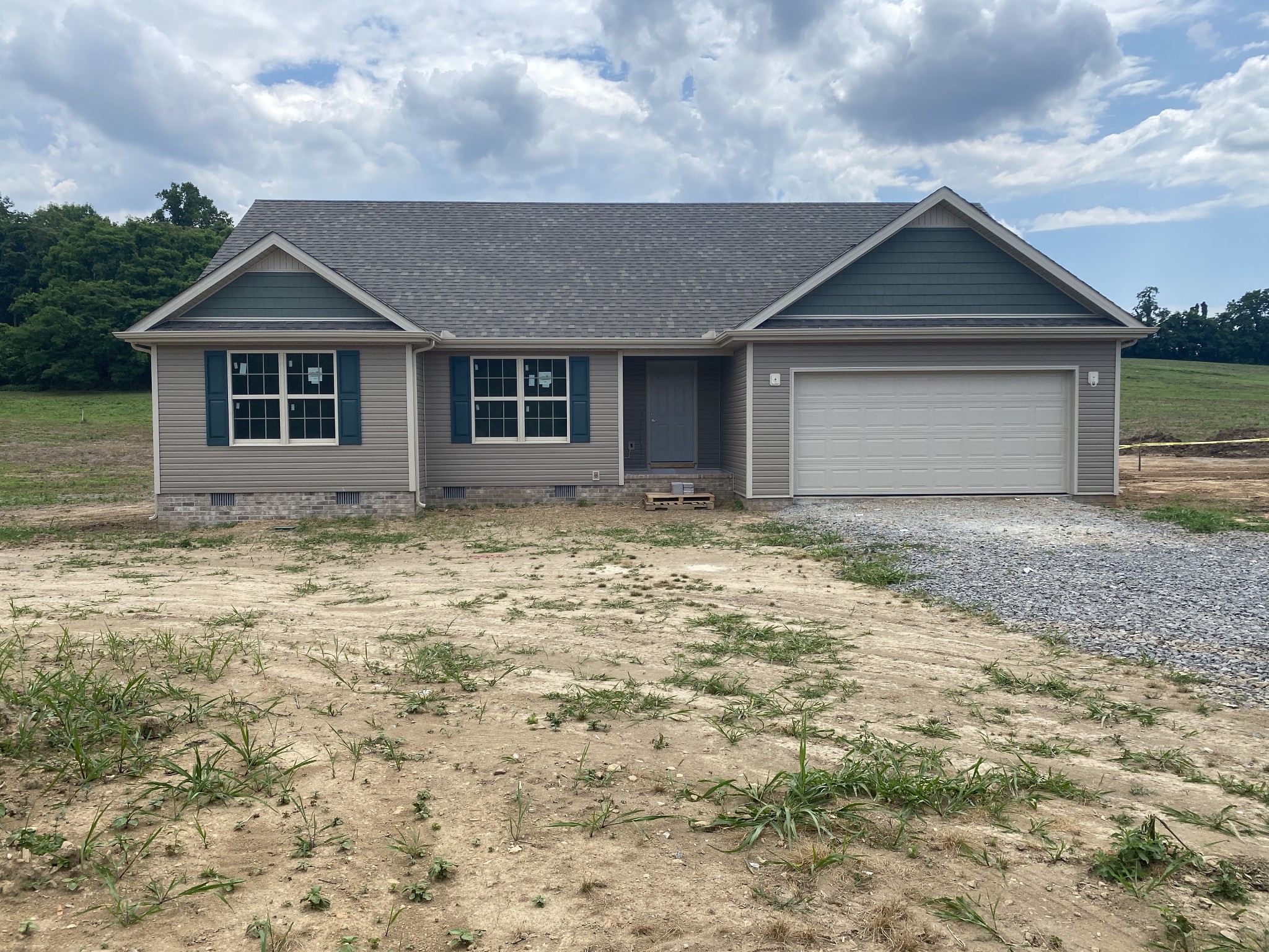 767 Jarrell Road Manchester, TN 37355 - Photo 1 of 8 a front view of a house with yard