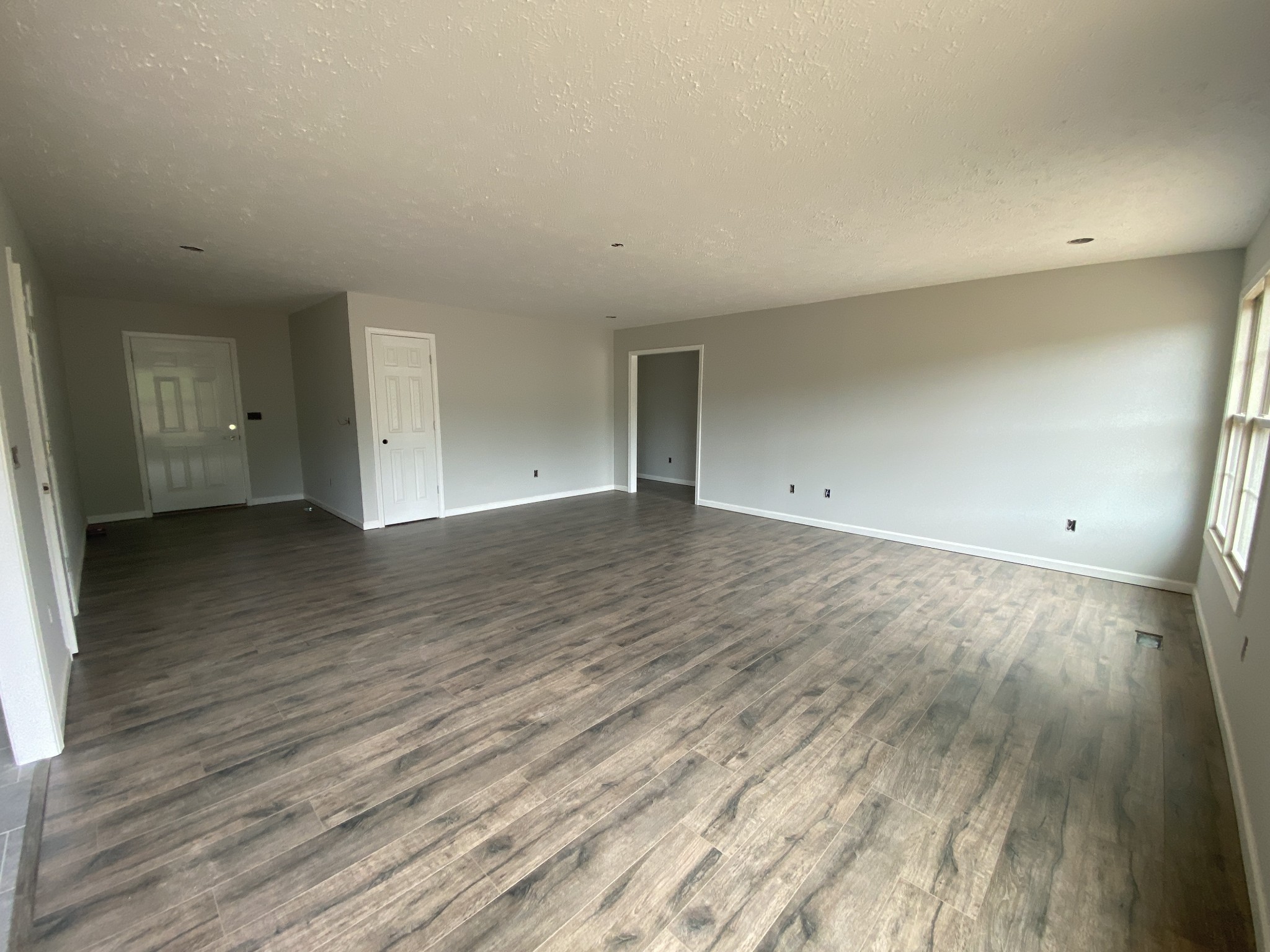 767 Jarrell Road Manchester, TN 37355 - Photo 3 of 8 a view of an empty room and wooden floor