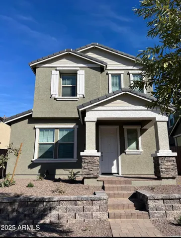 a front view of a house with garage