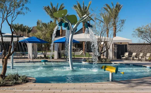a view of a house with swimming pool and a yard