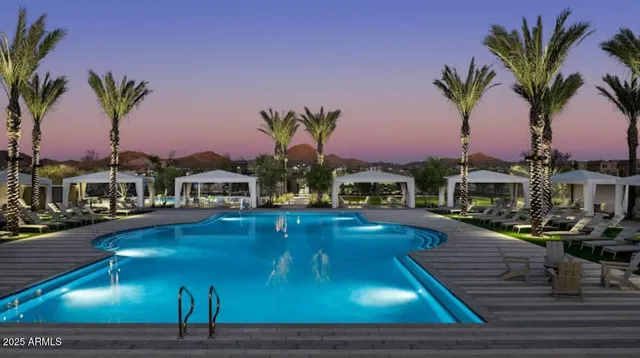 a swimming pool with outdoor seating and yard