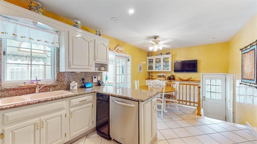 169 84th Street Brooklyn, NY 11209 - Photo 12 of 40 a kitchen that has a lot of cabinets in it and appliances