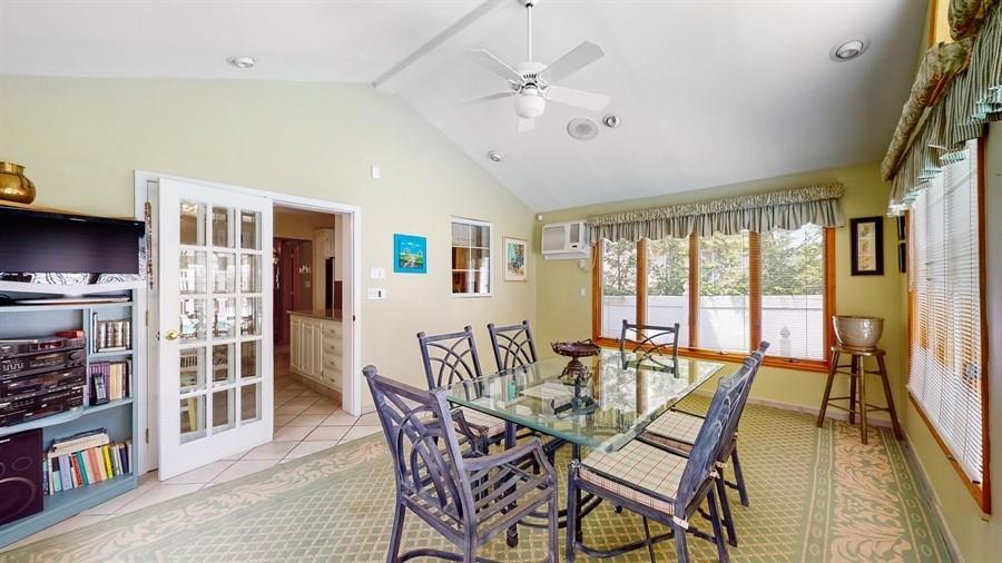 169 84th Street Brooklyn, NY 11209 - Photo 14 of 40 a view of a dining room with furniture and a book shelf