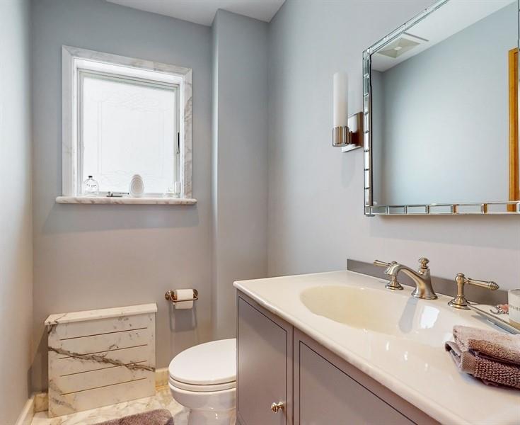 169 84th Street Brooklyn, NY 11209 - Photo 15 of 40 a bathroom with a granite countertop sink toilet and mirror