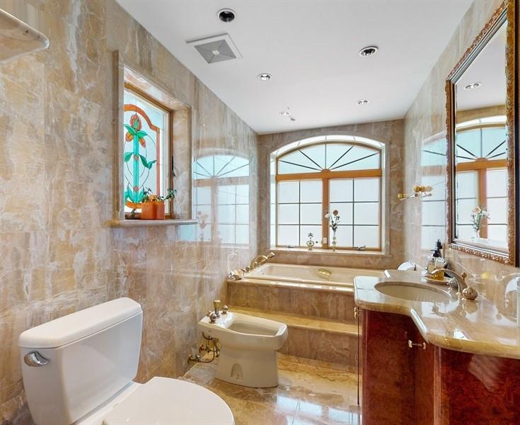 169 84th Street Brooklyn, NY 11209 - Photo 22 of 40 a bathroom with a sink and a large window