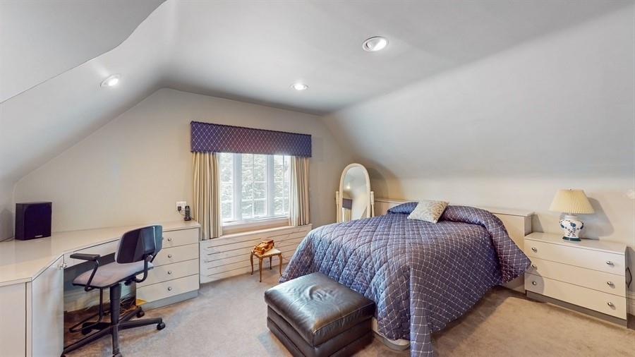 169 84th Street Brooklyn, NY 11209 - Photo 23 of 40 a spacious bedroom with a bed and a desk